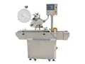 Étiqueteuse automatique pour surfaces planes