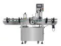 Étiqueteuse automatique pour bouteilles rondes
