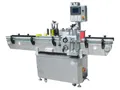Étiqueteuse automatique pour bouteilles rondes