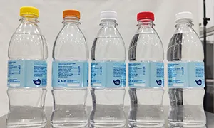 Étiqueteuse automatique pour bouteilles rondes