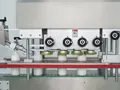 Remplisseuse-boucheuse automatique servo-commandée
